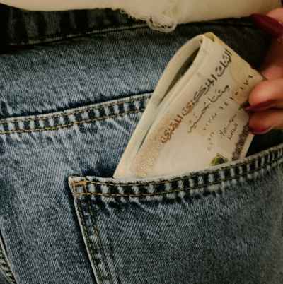 Egyptian Pound Banknotes Pulled from Jeans Pocket