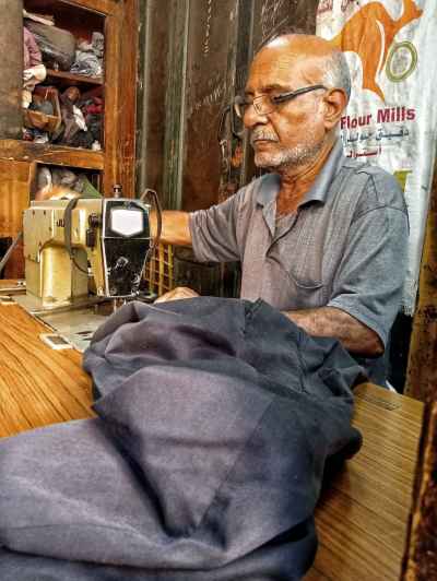 Traditional Egyptian Tailor Working in Al-Muizz Street Cairo