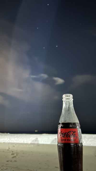 Coca-Cola Bottle on Beach at Night, North Coast Egypt