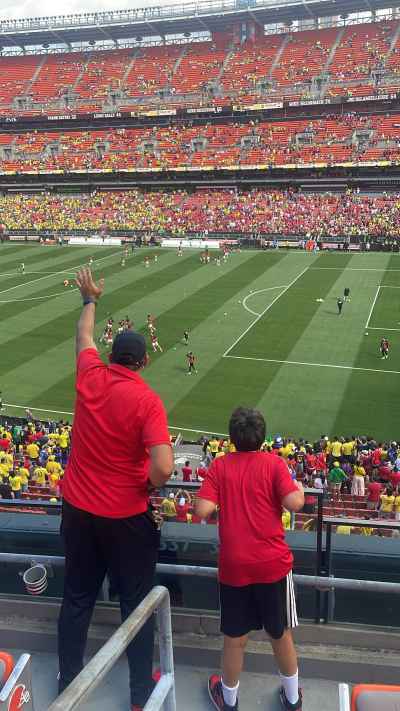 Father and Son Supporting Egypt at World Cup Stadium