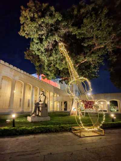 Illuminated Violin Sculpture Next to Mohamed Abdel Wahab Statue, Cairo Opera