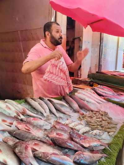 Fish Vendor at a Local Market