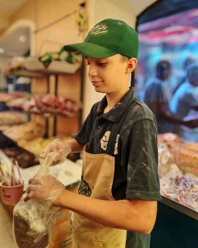 Boy Packaging Moulid Sweets, Bein El-Haraet, Ramses Cairo