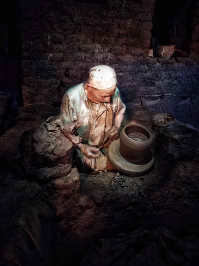 Elderly Potter Shaping Clay on Pottery Wheel, Al-Monofeya