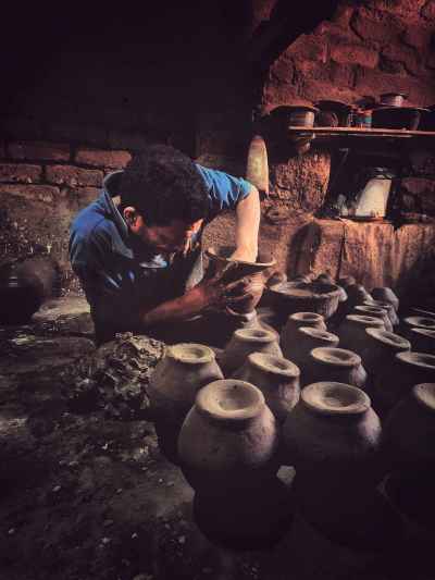 Potter Hand-Shaping Clay Vessel, Al-Monofeya Workshop