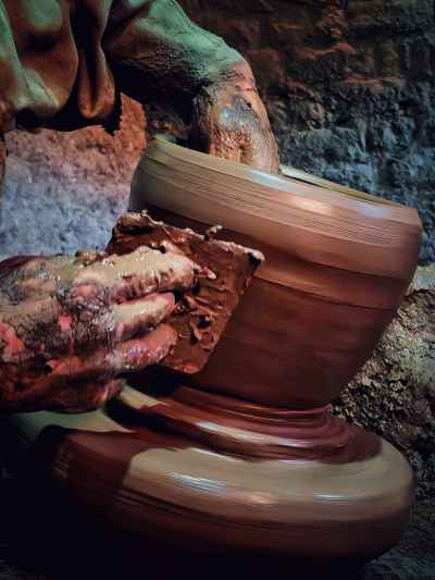Potter Shaping Clay Vessel on Spinning Wheel, Monufia