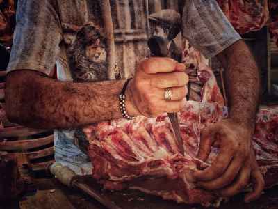 Egyptian Butcher Cutting Fresh Lamb Ribs in Cairo