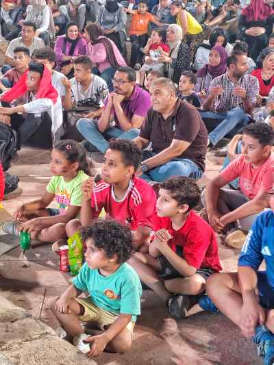 Egyptian Families Watching Outdoor Event Night Gathering
