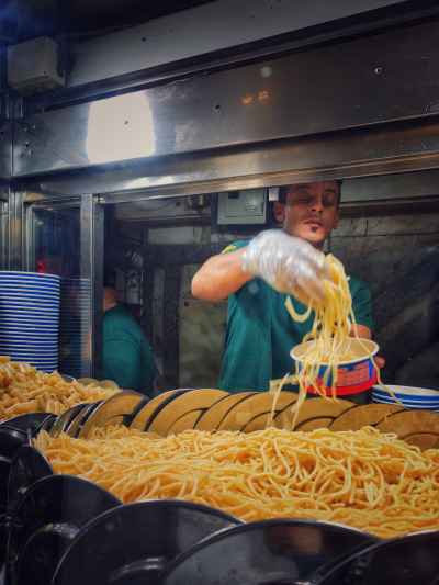 Makarona El Moamen Worker Serving Pasta, Cairo