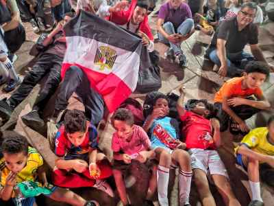 Egyptian Children Wrapped in National Flag at Celebration