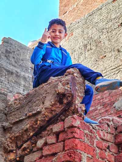 Egyptian Schoolboy Victory Sign on Red Brick Ruins, Kafr El Sheikh