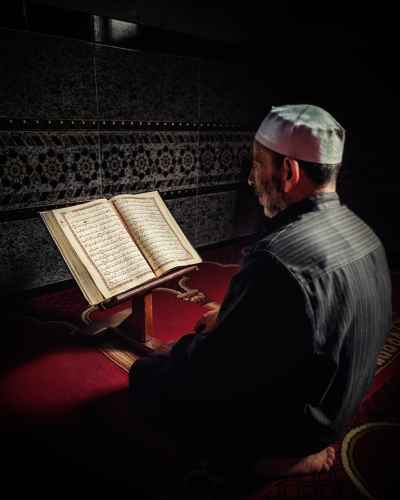 Elderly Man Reciting the Quran Inside a Village Mosque in Monufia