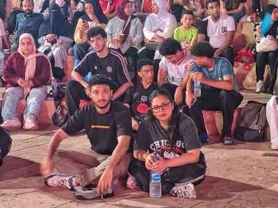 Egyptian Youth Sitting Together Awaiting Outdoor Event