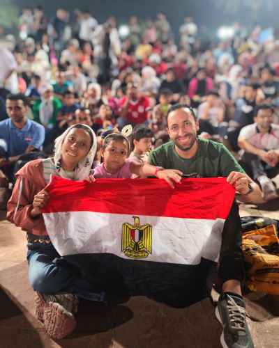 Egyptian Family Proudly Holding National Flag at Celebration