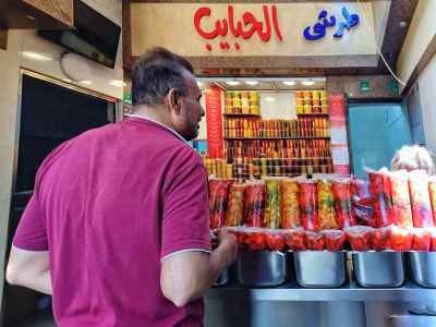 Customer Choosing Pickles at Torshi El Habayeb, Sayeda Zeinab