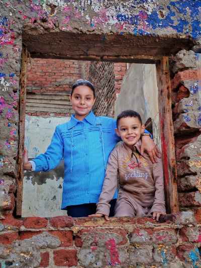 Two Children Smiling Through Old Window Frame, Kafr El Sheikh