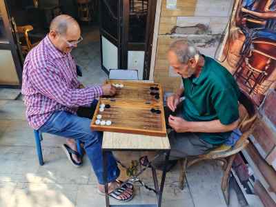 Two Elderly Men Playing Backgammon Outside Cairo Coffeehouse