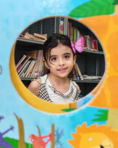 Girl Smiling Through Circular Frame, Children's Library Cairo