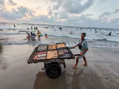 Street Vendor Pulling Sweets Cart, Ras El Bar Beach Sunset