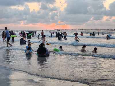 Families Swimming at Ras El Bar Beach at Sunset