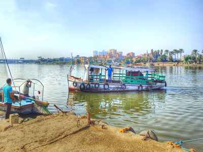 Nile River Working Boats Docked at Sandy Bank