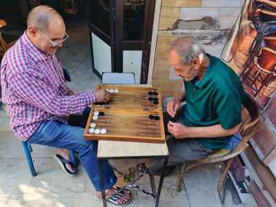 Two Men Playing Backgammon Outside Cairo Ahwa