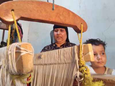 Egyptian Woman and Child at Traditional Wooden Loom, Giza