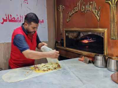 Baker Sealing Feteer Dough Before Wood-Fired Oven, Cairo