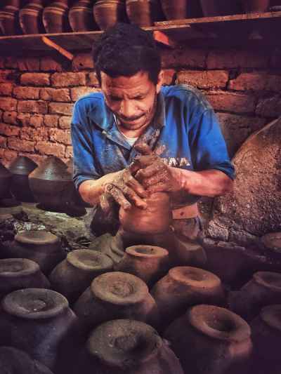 Potter Hand-Shaping Clay Vessel, Al-Monofeya Egypt