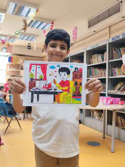 Child Displays Colored Cartoon Artwork at Cairo Library