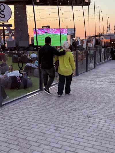 Walking Together to Watch the Match