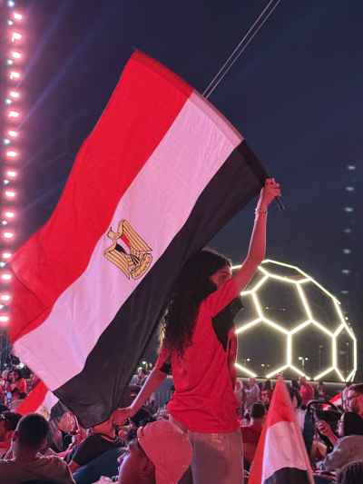 Egyptian Fan Waving Flag at Football Fan Zone Night