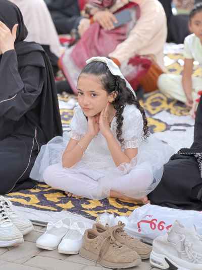 Little Girl Listening to Eid Sermon at the Mosque