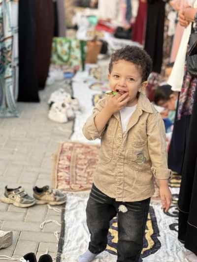 Toddler Smiling During Eid Prayer at the Mosque