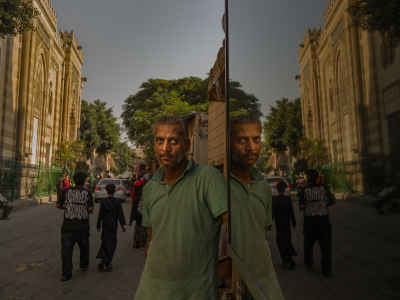 Street Worker Portrait with Mirror Reflection, Cairo