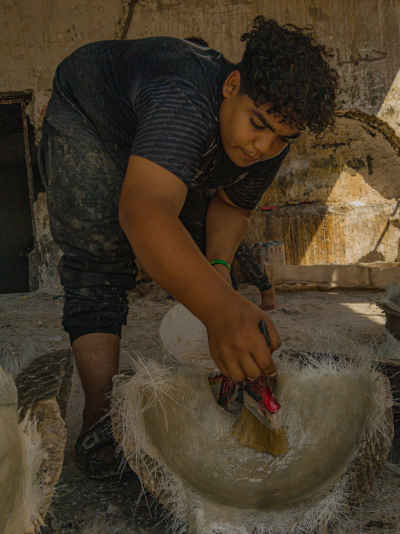 Potter Applying Finishing Coat to Clay Vessel, Cairo