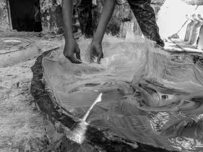 Worker Placing Fiberglass Raw Material Into Mold
