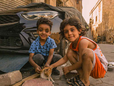 Two Egyptian Children Playing with Kitten, Al-Gamaliya Cairo