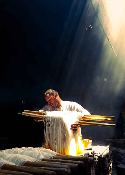 Dye Worker Handling Fabric in Sunlight, Cairo