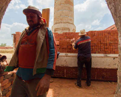 Brick Factory Workers Stacking Red Bricks, Al-Qanater