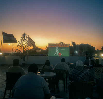 People Watching a Football Match Outdoors in Marsa Matrouh, Egypt