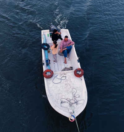 Fishermen on Wooden Boat, Nile River Rashid