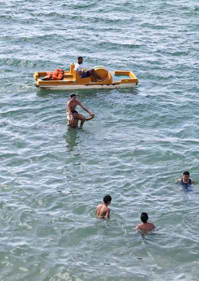 Group Swimming Near Yellow Pedal Boat, Alexandria Beach