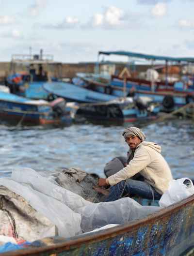 Fisherman Mending Nets on Boat, El-Max Alexandria