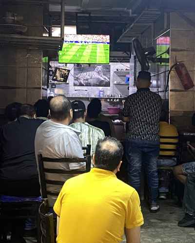 Egyptian Men Watching Football Match at Local Ahwa