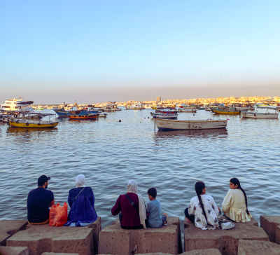 Family Sitting by Alexandria Harbor, Bahri Waterfront