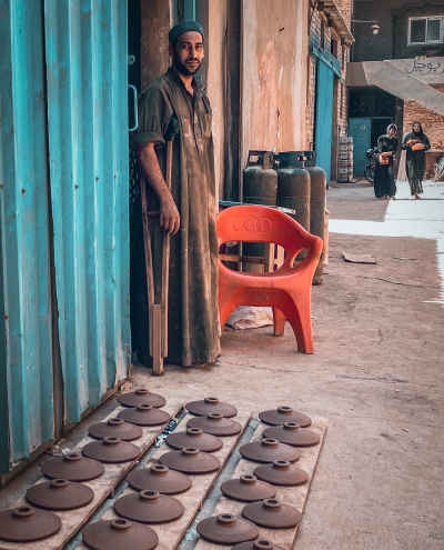 Potter Displaying Clay Pottery, Farasq Village Tanta