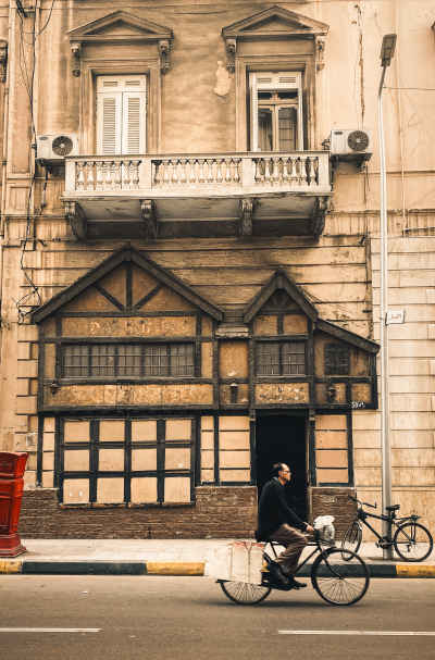 Cyclist on Fouad Street, Alexandria Historic Building