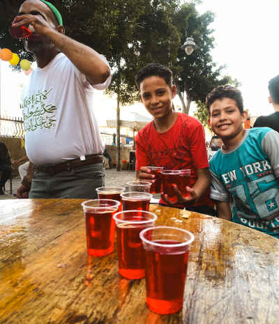 Sharbat Vendor Serves Children, Al-Manshiya Alexandria