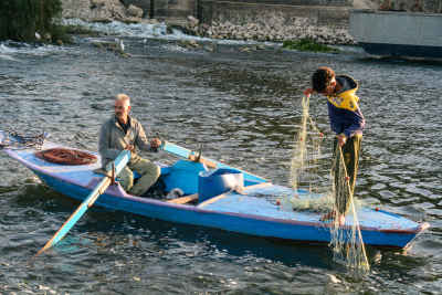 Two Fishermen Casting Net from Boat, Al-Qanatir